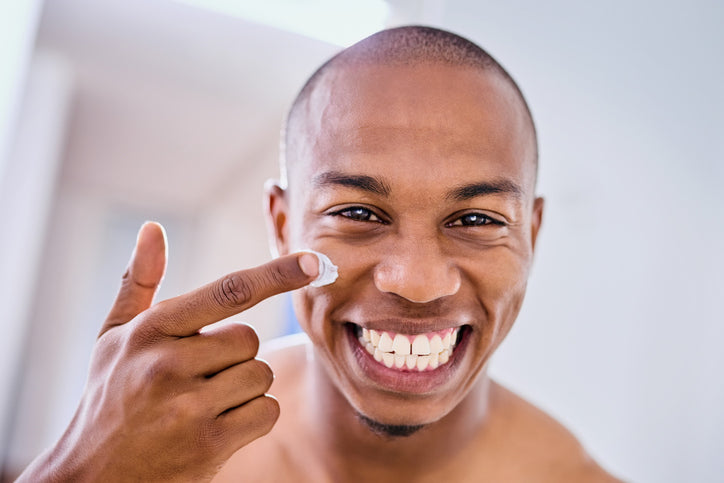 man applying natural face creme